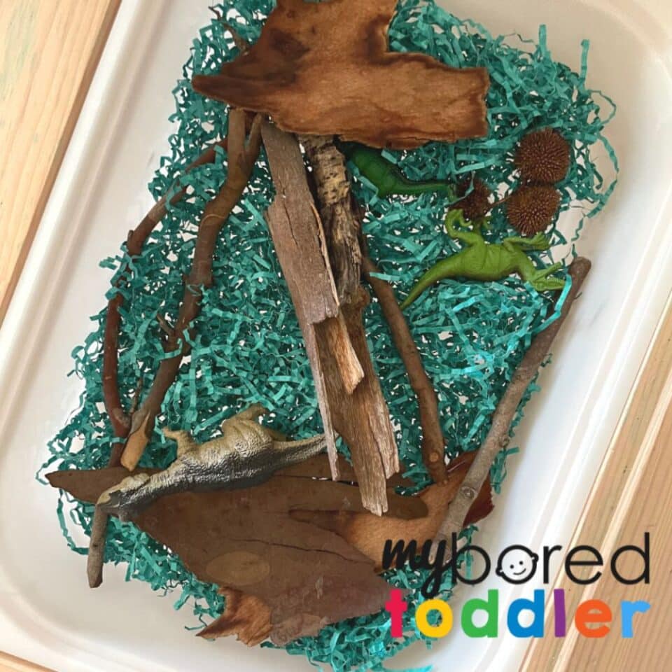 Dinosaur-Shredded Paper Sensory Bin - My Bored Toddler