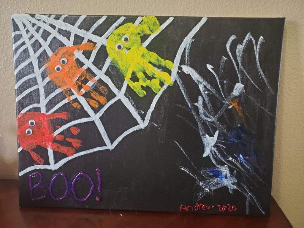 spider web handprint painting for toddlers 