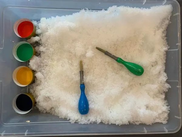 painting in the snow with paint droppers