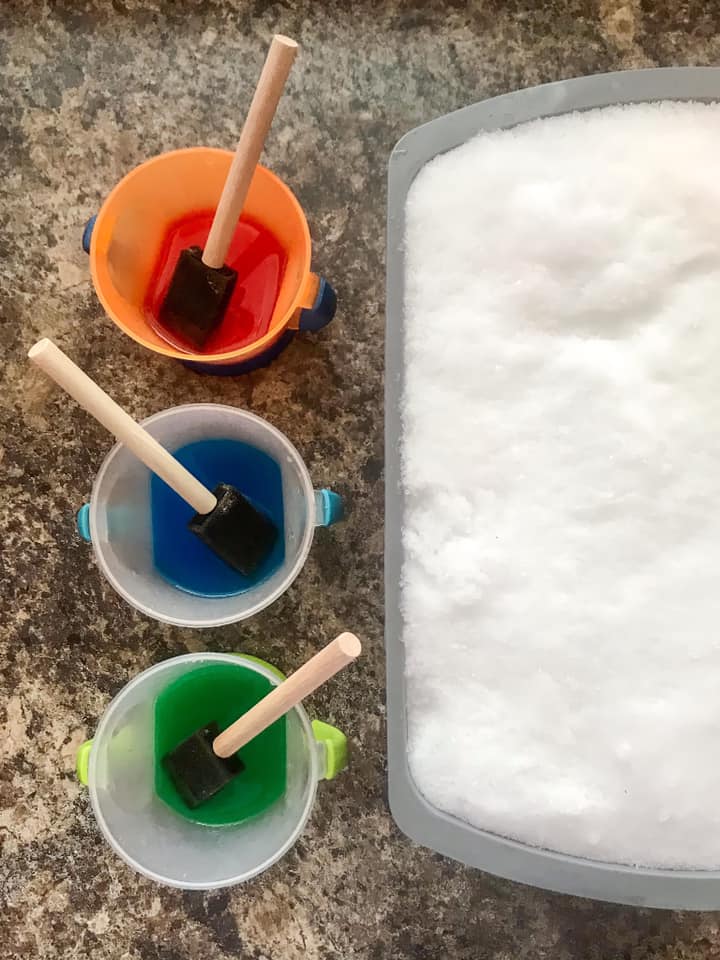 snow painting with foam brushes 
